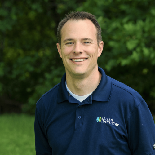 Dr. Justin Nylander in an Allen Dentistry polo shirt